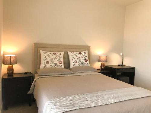 a bedroom with a large bed with two night stands at Perfect Apt near UCLA w Parking Gym Pool WIFI in Westwood B3 in Los Angeles