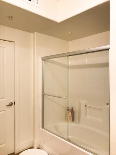 a bathroom with a shower and a toilet at Perfect Apt near UCLA w Parking Gym Pool WIFI in Westwood B3 in Los Angeles