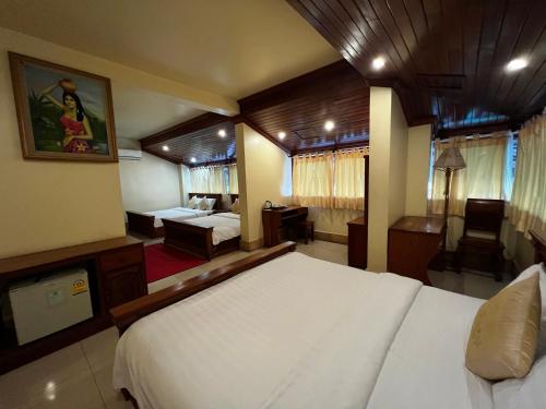 Ένα ή περισσότερα κρεβάτια σε δωμάτιο στο Shining Angkor Apartment Hotel