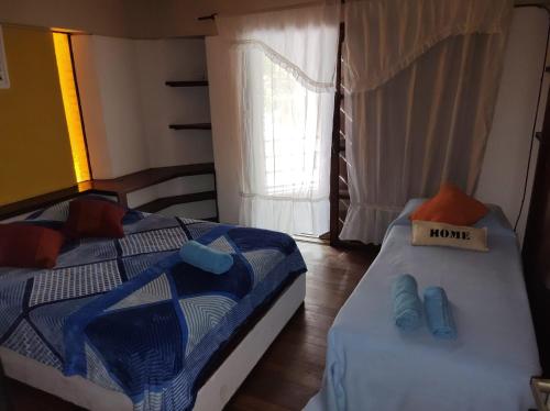 a bedroom with two beds and a sign that says more at T&A RESIDENCE Aeropuerto Ezeiza in Monte Grande