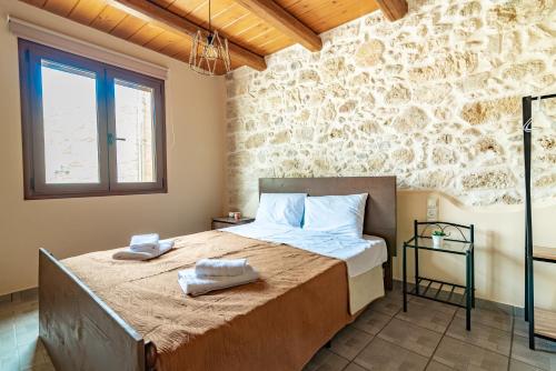 Un pat sau paturi într-o cameră la Villa Thalasena
