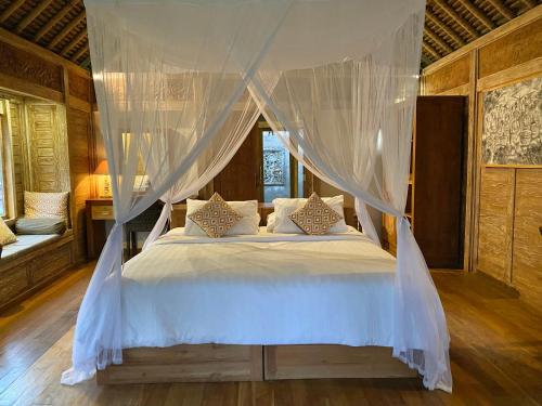 Letto o letti in una camera di Sawah Indah Villa