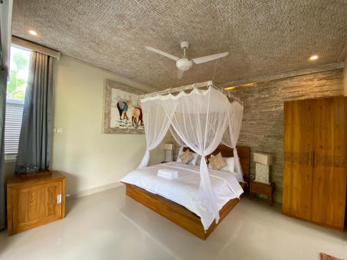 Letto o letti in una camera di Sawah Indah Villa