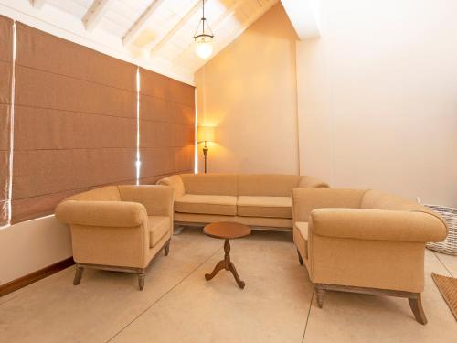 a waiting room with two chairs and a couch at Heritage Boutique by Seven Angels in Kandy