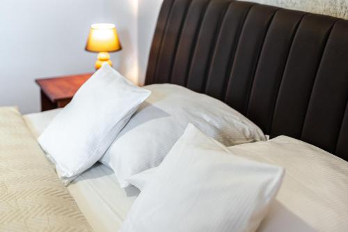 Una cama o camas en una habitación de Browar Gościniec Chojnice