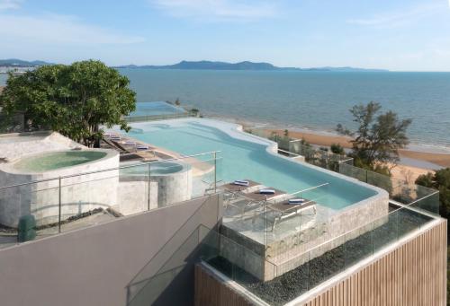 a view of a swimming pool on top of a building at Bayphere Hotel Pattaya in Na Jomtien