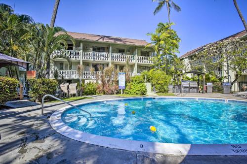 a large swimming pool in front of a house at OUTSTANDING OCEANFRONT STUDIO - KONA ISLANDER INN CONDOS condo in Kailua-Kona