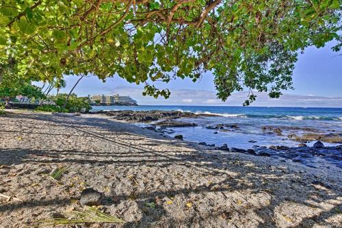 a sandy beach with trees and the ocean at OUTSTANDING OCEANFRONT STUDIO - KONA ISLANDER INN CONDOS condo in Kailua-Kona