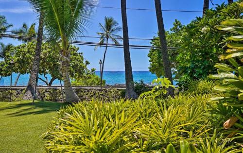 a view of the ocean from a resort with palm trees at OUTSTANDING OCEANFRONT STUDIO - KONA ISLANDER INN CONDOS condo in Kailua-Kona