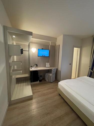 Ένα ή περισσότερα κρεβάτια σε δωμάτιο στο Hotel Arena