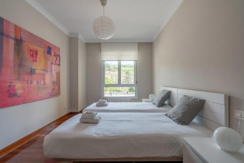 A bed or beds in a room at Zubia apartment by People Rentals