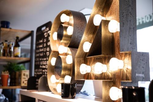 a bunch of lights on a wall in a store at The People - Tours in Tours