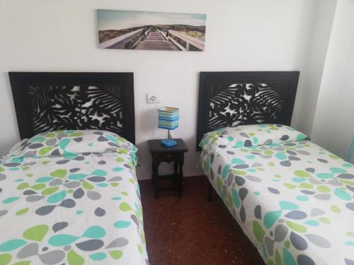 Кровать или кровати в номере Estudio con vistas al mar