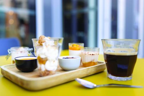 a tray with drinks and bowls of food on a table at The People - Tours in Tours
