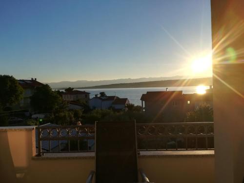 a view of the sunset from a balcony at Apartments Jelena Vantačići in Vantačići