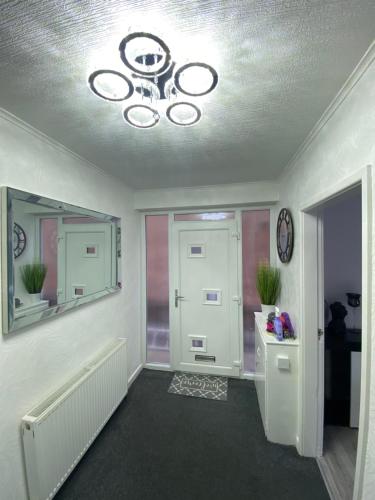 a room with a ceiling with a chandelier at NEW…THE HOTTUB HOUSE BLACKPOOL PLEASURE BEACH in Blackpool