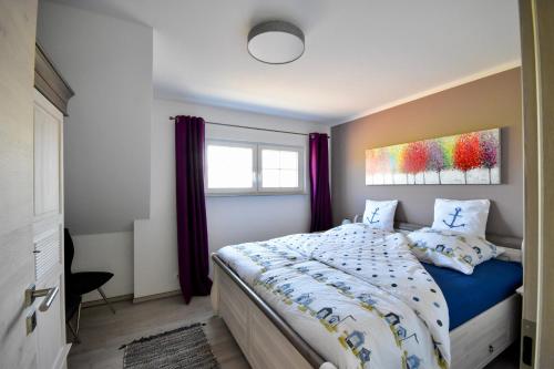 Ένα ή περισσότερα κρεβάτια σε δωμάτιο στο Ostseehaus Anker