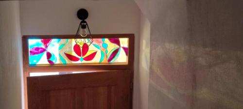 a door with a stained glass window on it at Apartmán maxi - Café Princ pod hradem KLIMA, WiFi in Šternberk