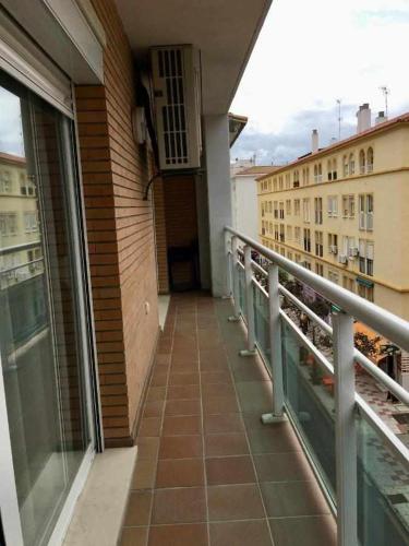 a balcony with a view of a building at Chicflat Avenida España. Ideal para familias in Estepona