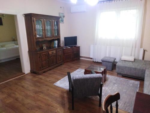 a living room with a couch and a table at Mala bašta in Bajina Bašta