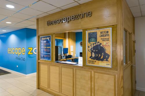 a store front with a sign for aigle zco at Sporting Lodge Inn Middlesbrough in Middlesbrough