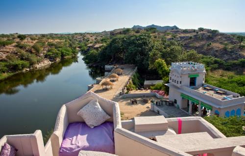 an aerial view of a river with a house at Brij Lakshmansagar, Pali - Small Luxury Hotels of the World in Raipur