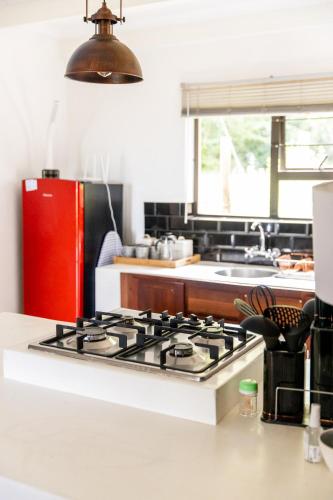 a kitchen with a stove top in a kitchen at Belvidere Country Estate in Karkloof Nature Reserve