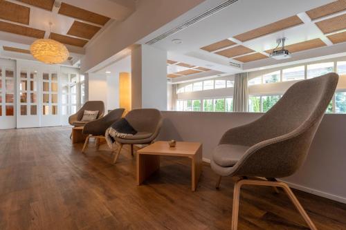Hotel Victoria Lauberhorn Wengen, a Faern Collection Hotelにあるシーティングエリア