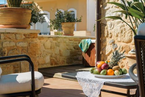a bowl of fruit on a table on a patio at Casa Di Veneto in Hersonissos