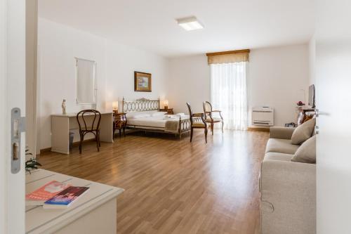 a living room with a couch and a table at Scicli Albergo Diffuso in Scicli
