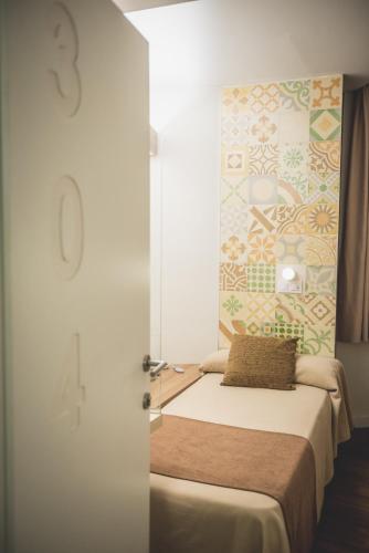 Postel nebo postele na pokoji v ubytování Hostal Marenostrum