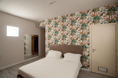 Кровать или кровати в номере Hotel Ca' di Gali