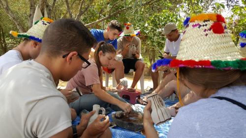 a group of people sitting around a table with a cake at Gite Talassemtane in Chefchaouene