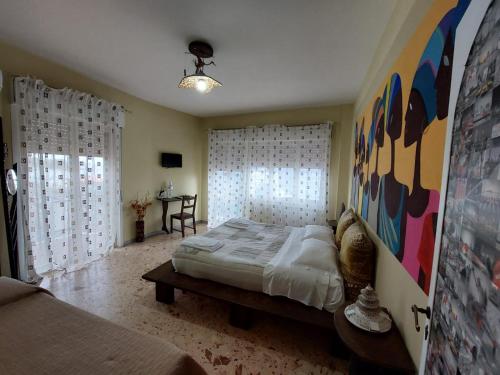 Postel nebo postele na pokoji v ubytování B&B Il MappaMondo