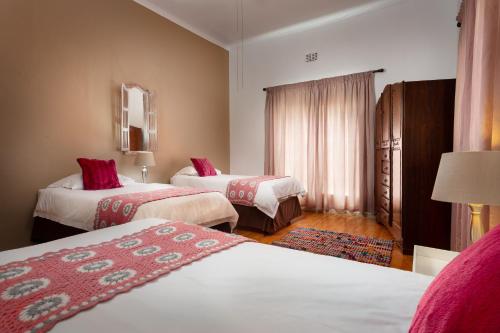Säng eller sängar i ett rum på Karoohuisie