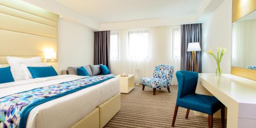 Postel nebo postele na pokoji v ubytování Hotel Festival