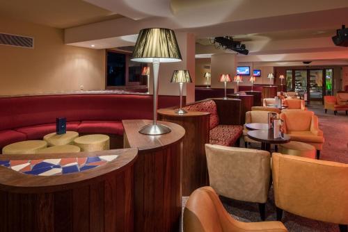 a lobby of a hotel with couches and tables at TUI Blue Gardens - Adults-only - Savoy Signature in Funchal