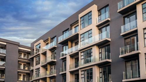 an apartment building with balconies on the side of it at The Catalyst Apartment Hotel by NEWMARK in Johannesburg