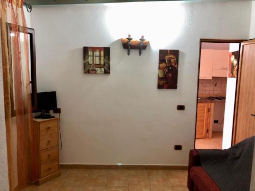 TV a/nebo společenská místnost v ubytování Residence Il Melograno