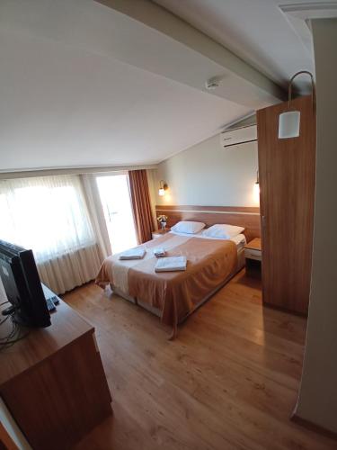 Ένα ή περισσότερα κρεβάτια σε δωμάτιο στο Aycan Sultan Apart Hotel