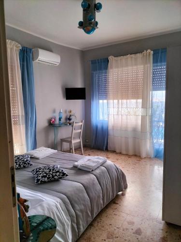 Ένα ή περισσότερα κρεβάτια σε δωμάτιο στο B&B Il MappaMondo
