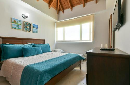 Postel nebo postele na pokoji v ubytování PENTHOUSE AGUAMARINA