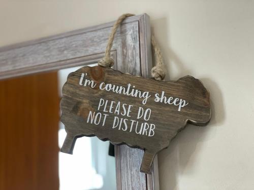 a sign that says im counting sheep please do not disturb at The Ship in Parkgate