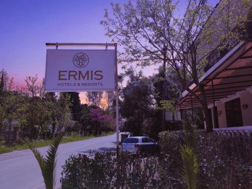 a sign for an emmis hotel and resorts at Ermis Hotels & Resorts in Lygia