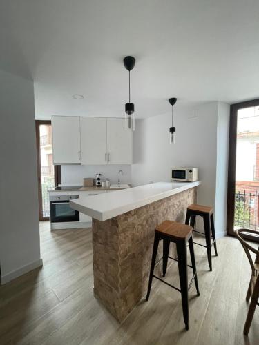 Kuchyň nebo kuchyňský kout v ubytování Carmela Apartment.