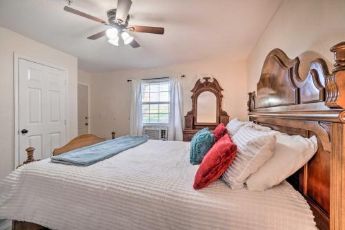 a bedroom with a large bed with a ceiling fan at Family-Friendly Condo about 3 Mi to Branson Landing in Branson