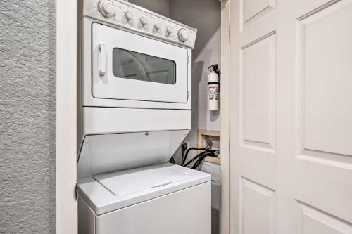 a white oven sitting on top of a toilet at Family-Friendly Condo about 3 Mi to Branson Landing in Branson