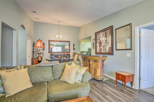 a living room with a couch and a table at Cheery Condo with Community Pool and Waterslide! in Pine Bluff