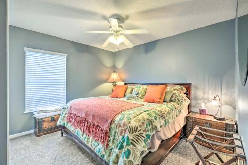 a bedroom with a bed and a ceiling fan at Cheery Condo with Community Pool and Waterslide! in Pine Bluff