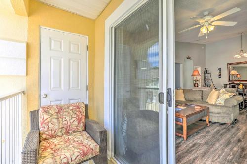 a living room with a couch and a table at Cheery Condo with Community Pool and Waterslide! in Pine Bluff
